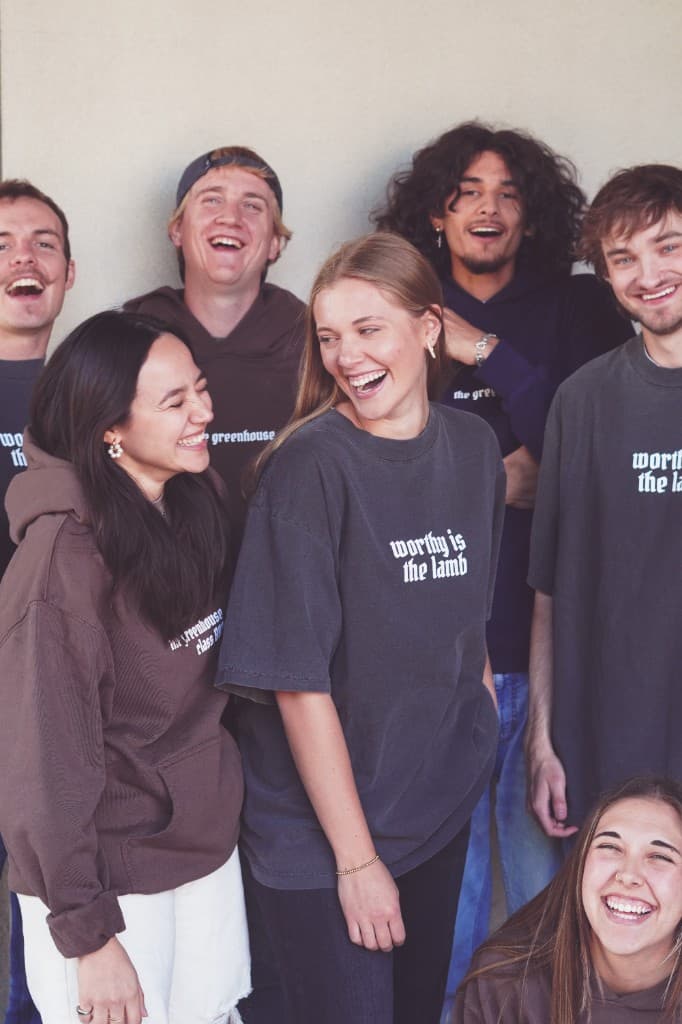 Greenhouse students laughing together in community
